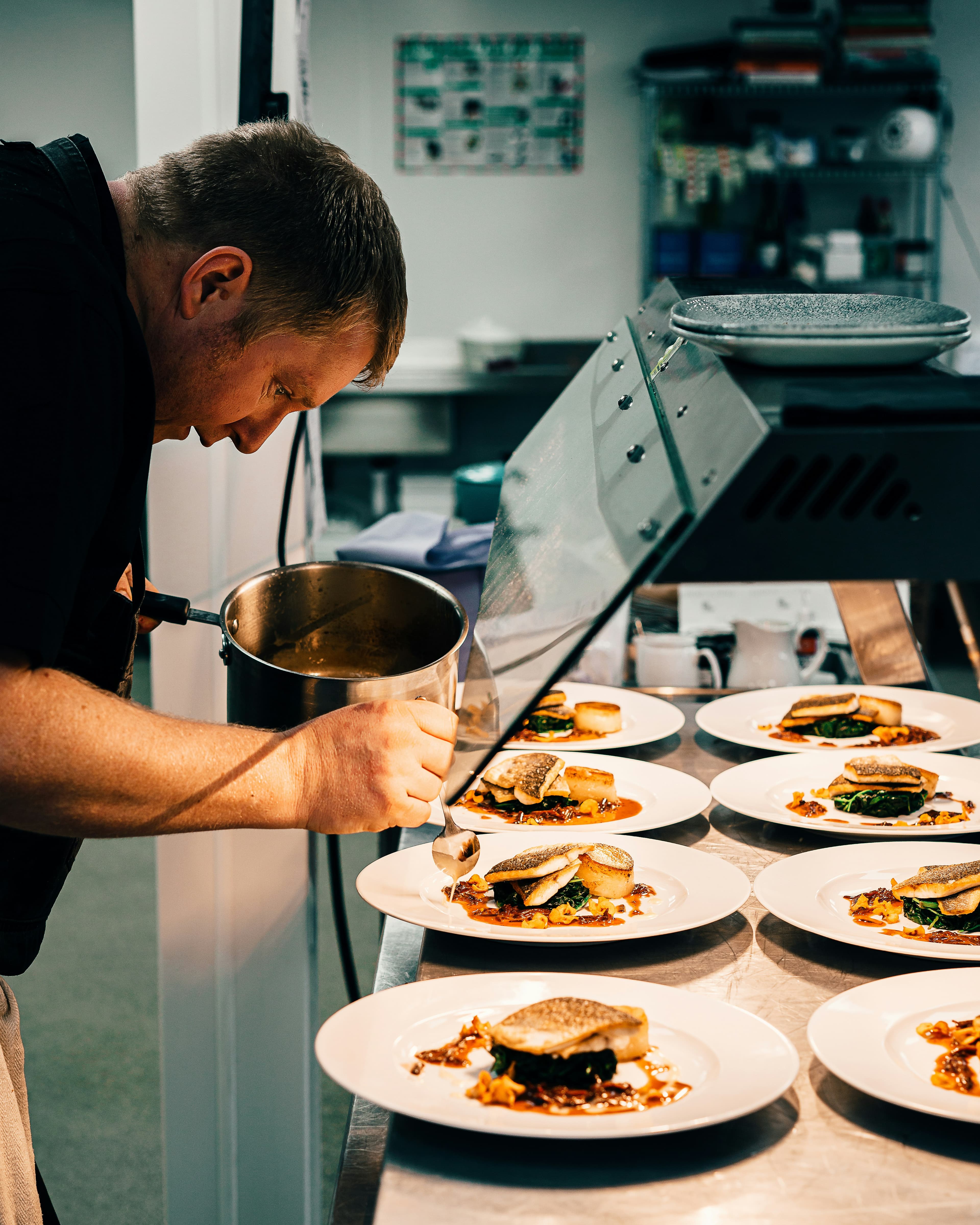 Chef at work in a professional kitchen station